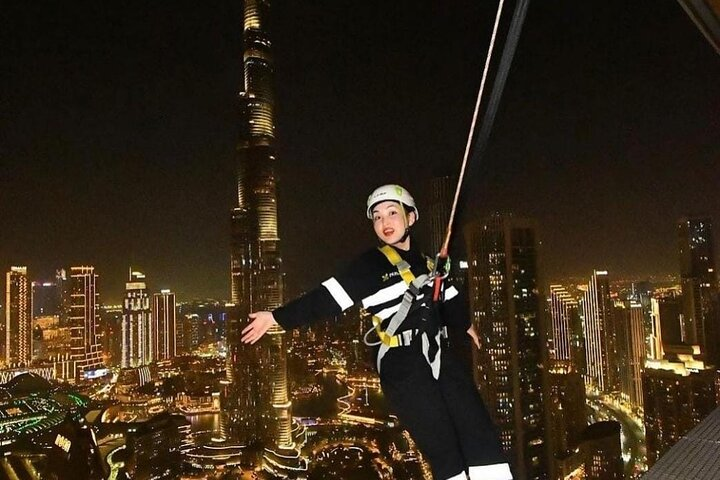 Experience an unforgettable perspective on Dubai's skyline while walking 219.5 meters above ground with the iconic Burj Khalifa shimmering below and enjoy expert guidance throughout your journey.